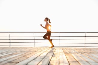 graphicstock-cute-young-sportswoman-running-on-pier-in-the-morning_ru4k0ifB2e