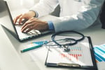 storyblocks-doctor-working-with-medical-statistics-and-financial-reports-in-office_rM8R3dFzkE