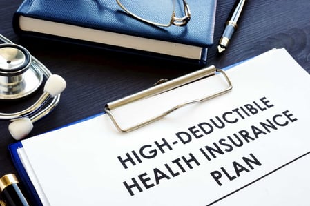 storyblocks-high-deductible-health-insurance-plan-hdhp-on-a-desk_S-_7-aPPQ